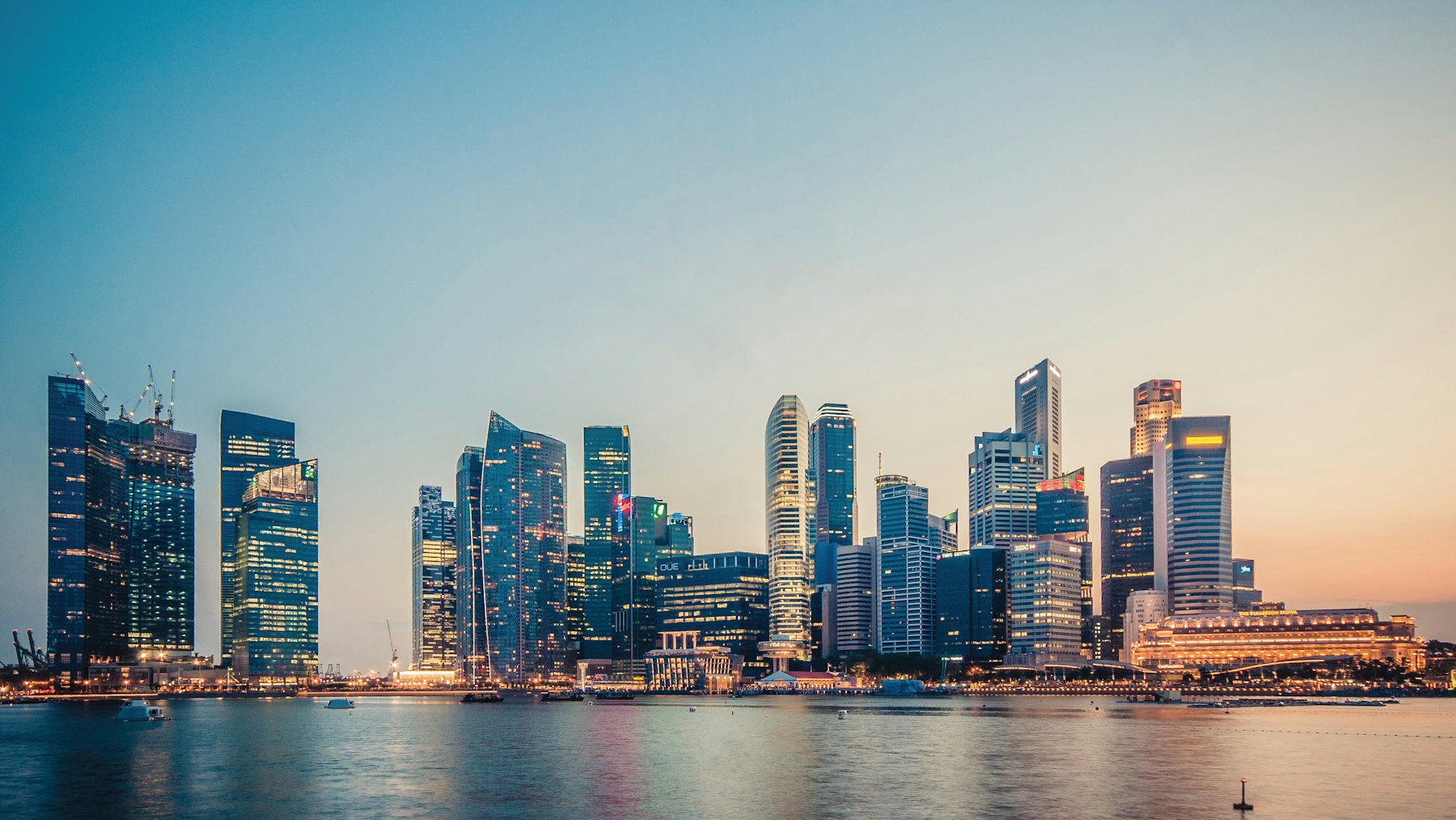 Singapore skyline across the bay at dusk